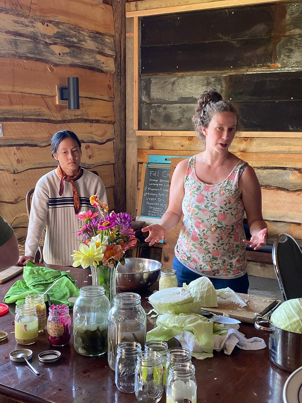 2025 Permaculture class learning how to measure contours along a hill with a DIY tool